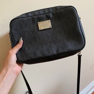 Michael Kors crossbody bag....9 1/2 in length..7 1/2 height...